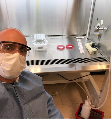 Lionel Faure preparing test tubes in the TWU biology laboratory. Photo courtesy Juliet Spencer.