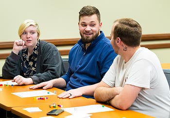 Three students at a table