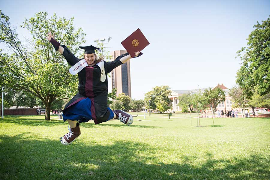 Leslie Fredrickson wears Oakley's feet in academic regalia.