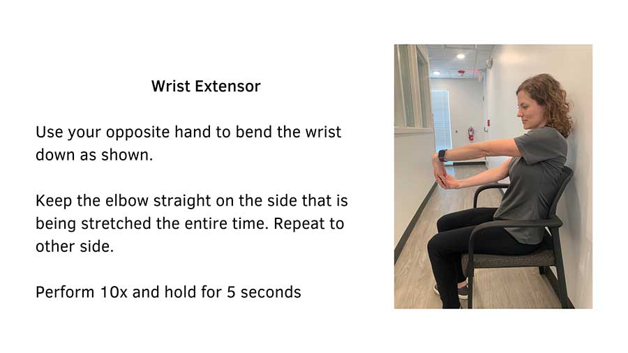 Black text on a white background that reads, "Wrist Flexor: Use your opposite hand to bend the wrist up as shown. Keep the elbow straight on the affected side the entire time. Repeat to the other side. Perform 10x and hold for 5 seconds". A woman sitting in a chair performing the stretch is featured.